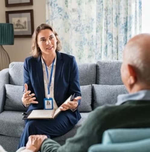 A healthcare professional talking to another person