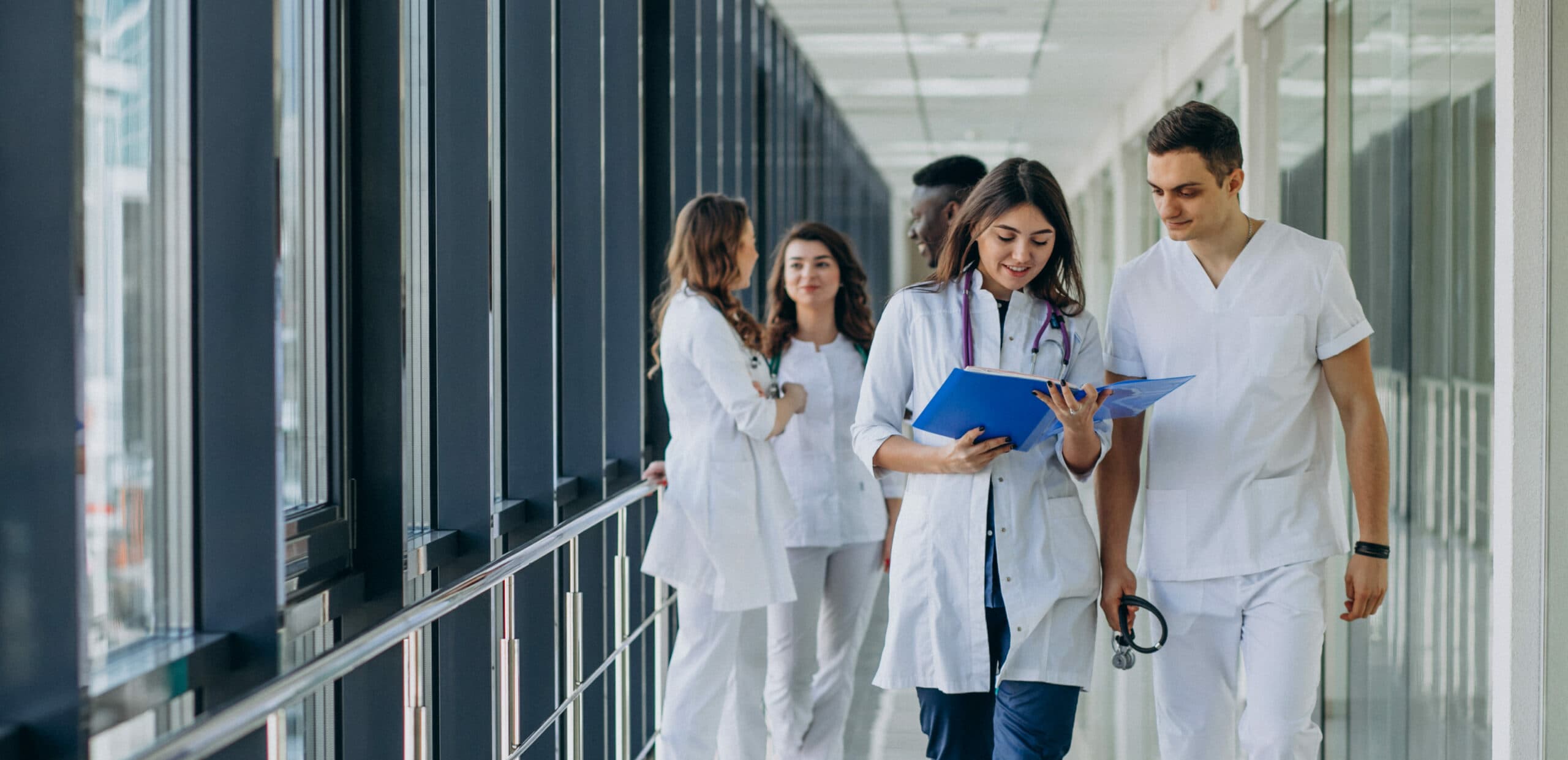 team-young-specialist-doctors-standing-corridor-hospital